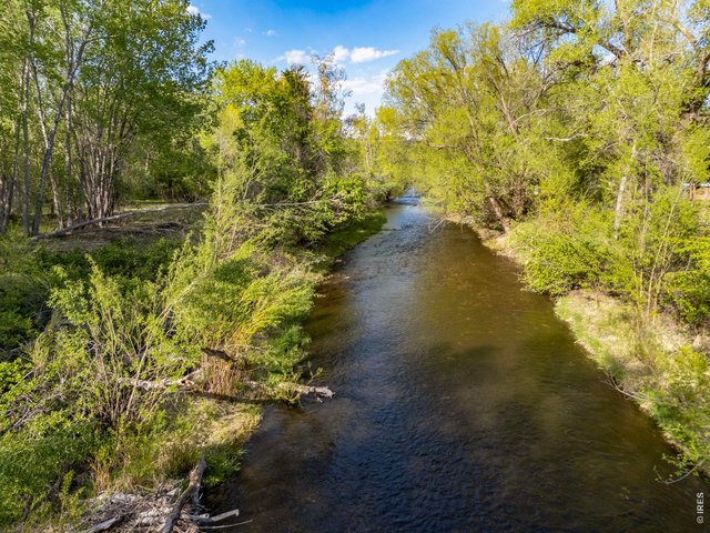 Property Photo 25 Another view of the Big Thompson River as it winds through the wooded eastern portion of the property.