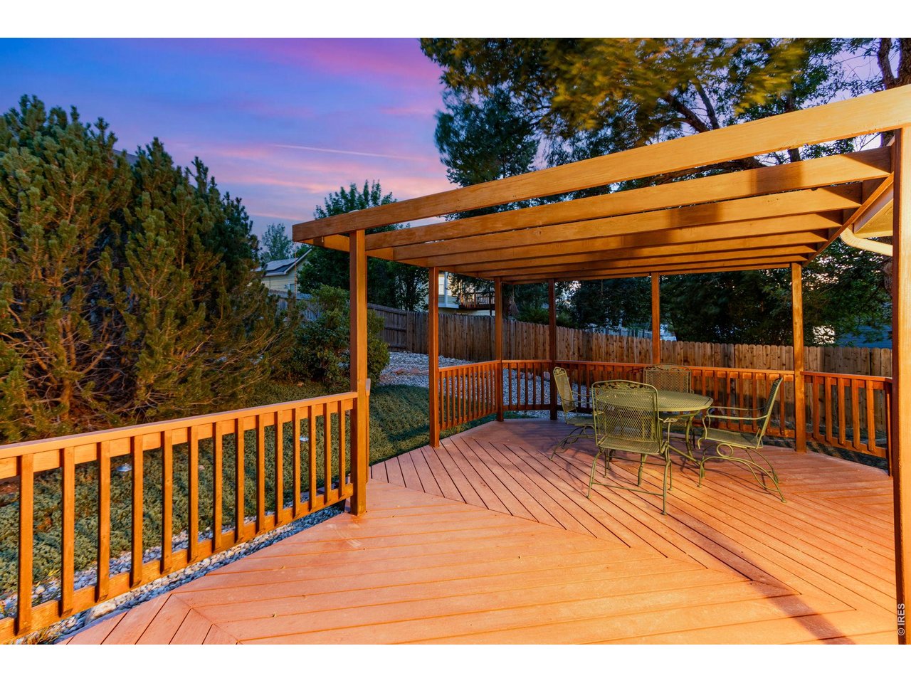 Property Photo 4 Large deck with pergola and mature landscaping