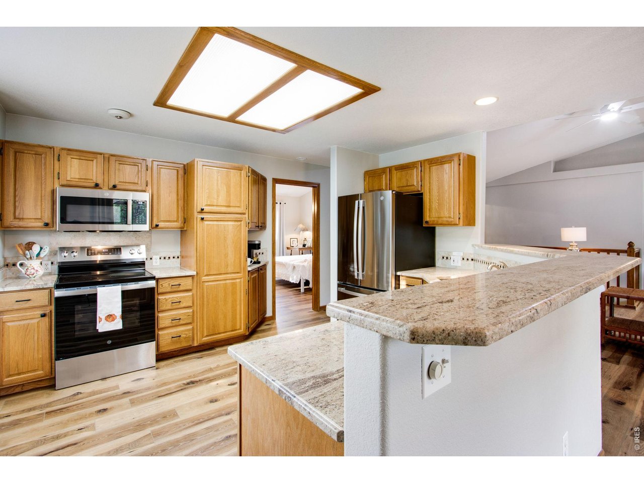 Property Photo 13 center island with breakfast bar, nook with bay window and a baristas beverage corner or docking station