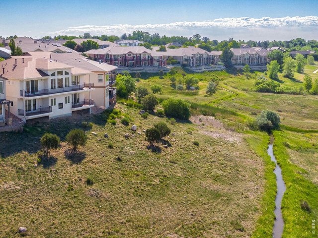 Property Photo 2 The heart of a nature lover soars with trails right outside, the entire Cathy Fromme Prairie & Open Space behind and the trail head just down the stree! Curated Modern Design & Feel, Xeriscaped. Exquisitely finished + adorned! 3,783 total SQFT.