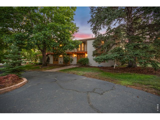 Property Photo 40 Expansive front courtyard and mature landscaping create a warm first impression.