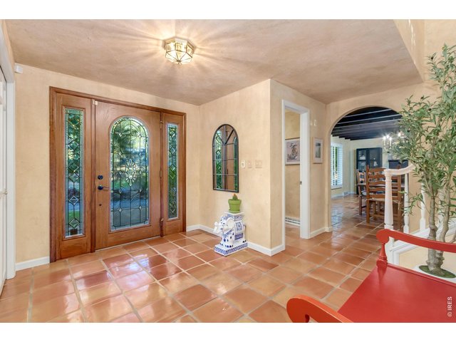 Property Photo 18 Custom solid wood front door with decorative leaded glass welcomes you inside