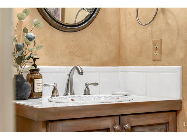 Property Photo 22 Custom hand-painted sink in the elegant powder room. - Total of 2 powder bathrooms on the main level.
