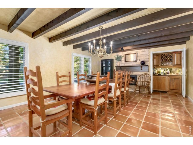 Property Photo 2 Private formal dining room with exposed wood beams.