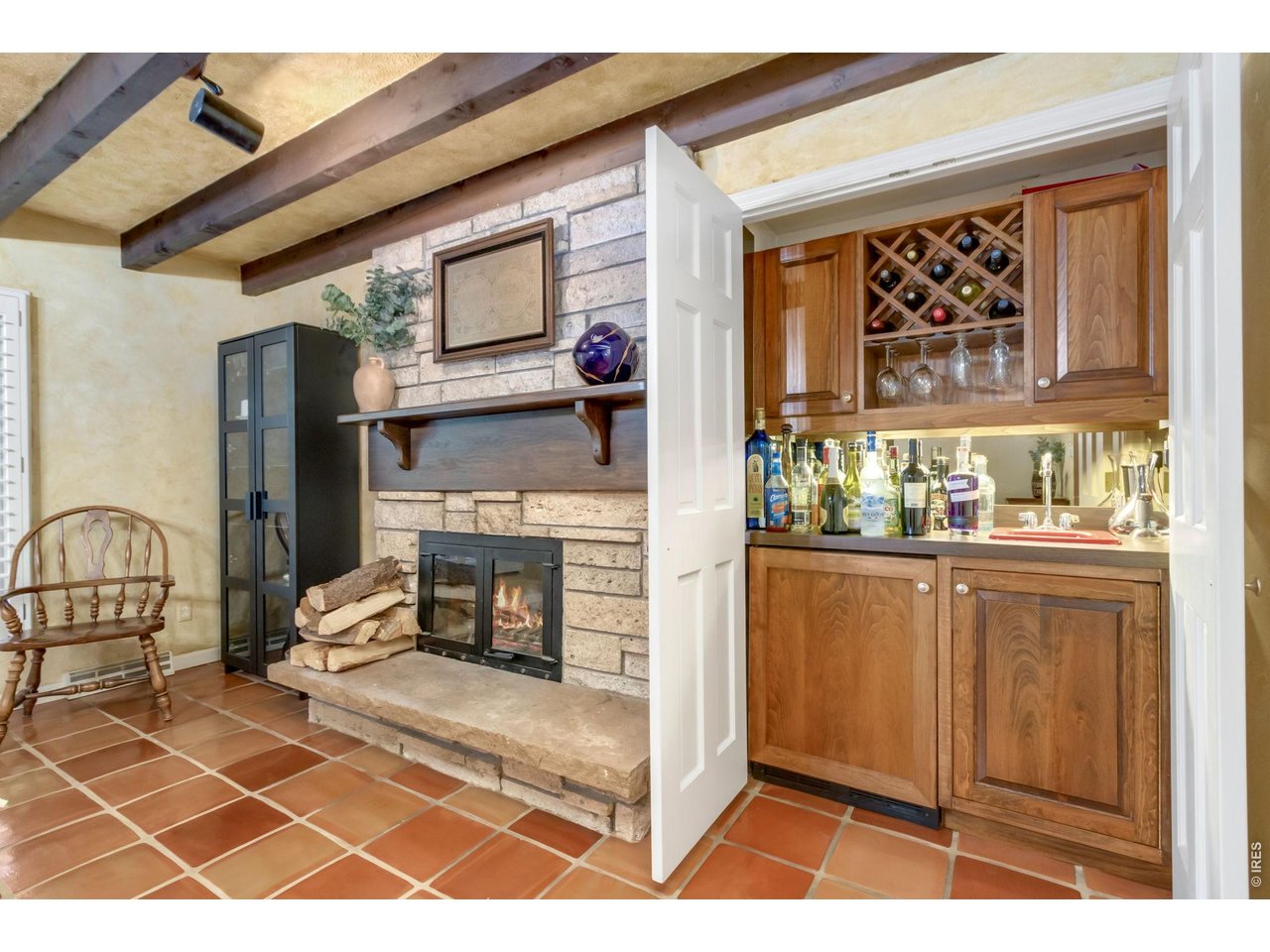 Property Photo 20 Hidden built-in wet bar tucked behind custom cabinetry.