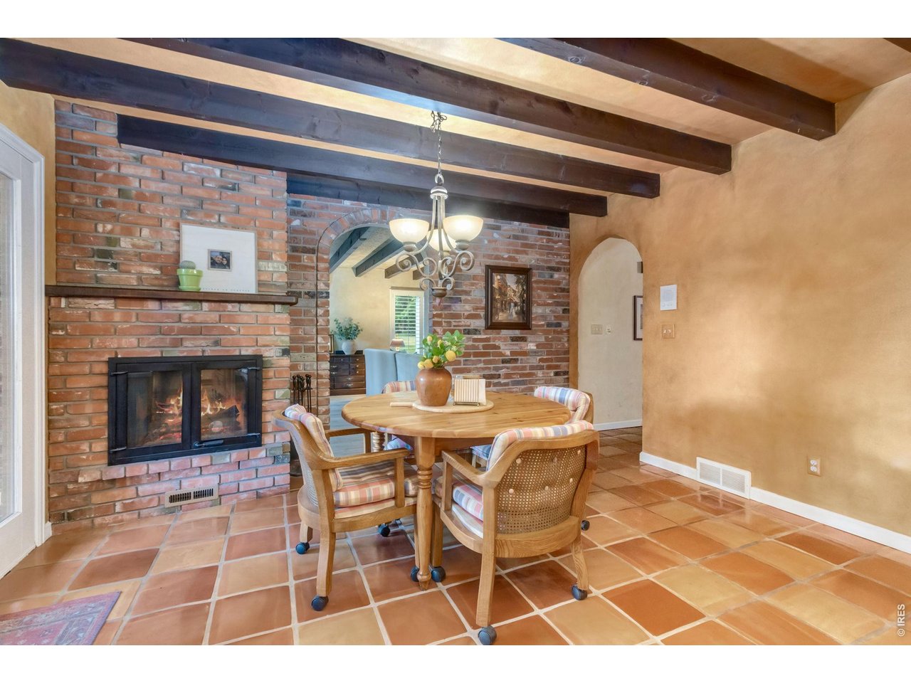 Property Photo 9 Character-filled kitchen featuring authentic exposed brick accents.