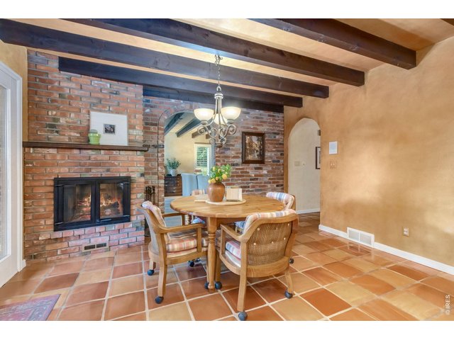 Property Photo 9 Character-filled kitchen featuring authentic exposed brick accents.