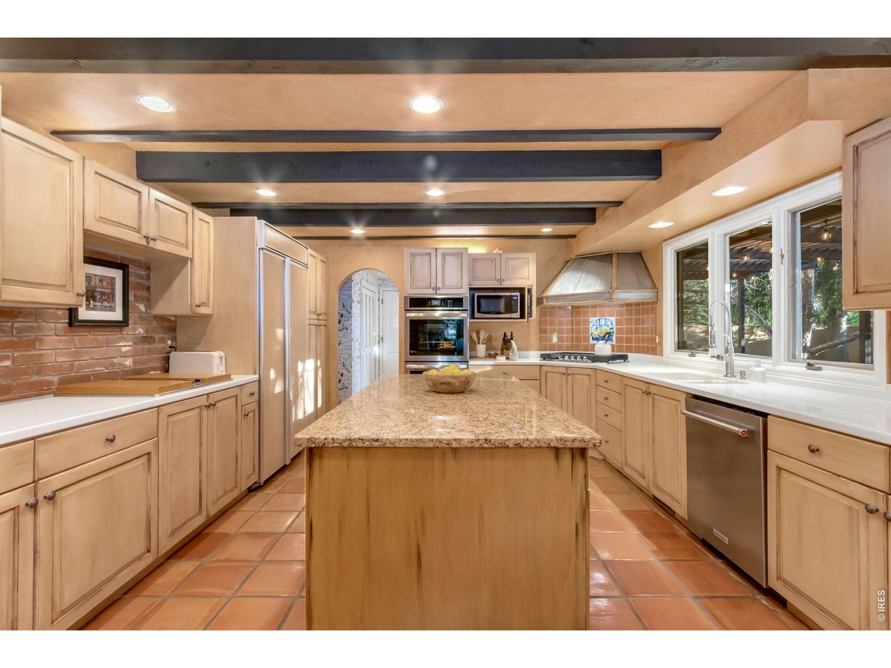 Property Photo 5 Large center island offers abundant prep and gathering space.