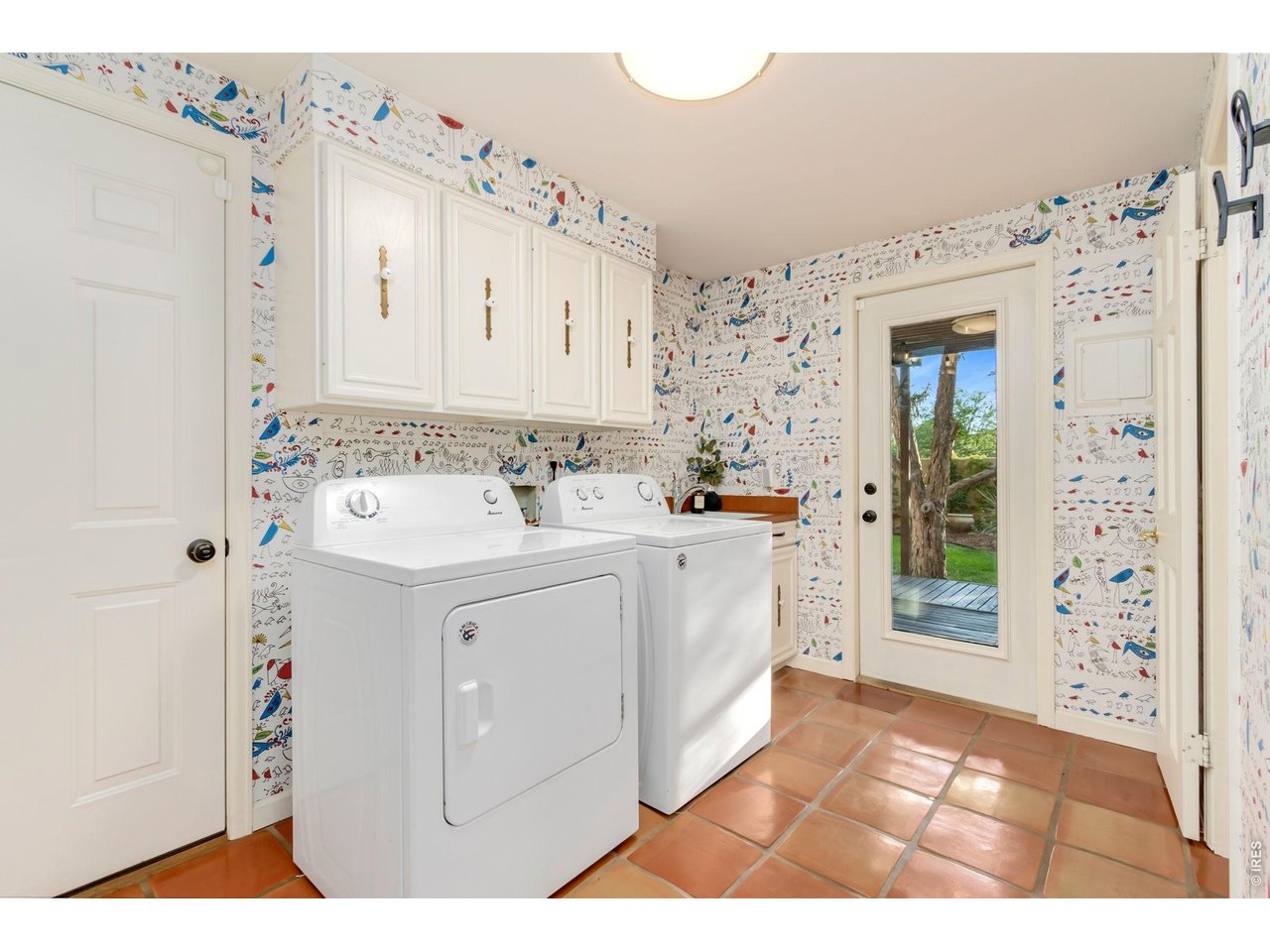 Property Photo 23 Convenient laundry and mudroom with additional half bath.