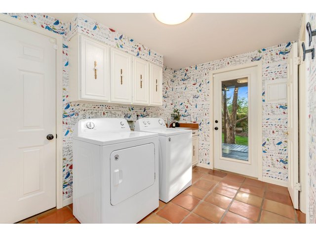 Property Photo 23 Convenient laundry and mudroom with additional half bath.