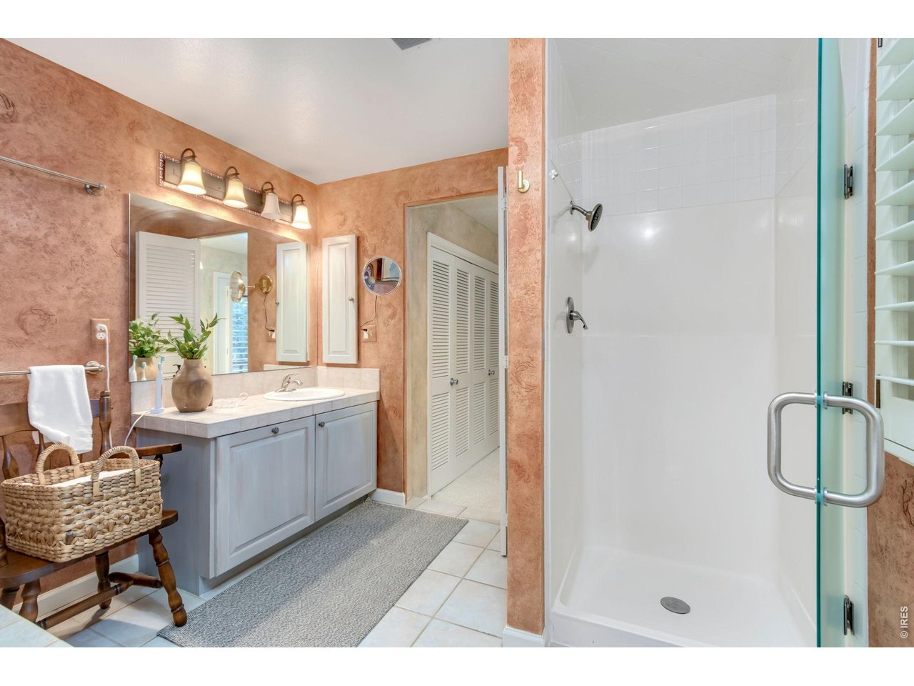 Property Photo 27 Separate walk-in shower and additional linen storage.