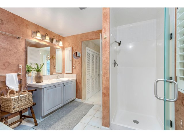 Property Photo 27 Separate walk-in shower and additional linen storage.