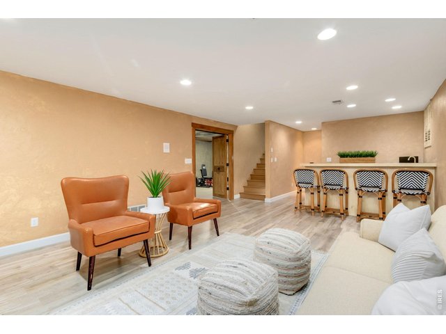 Property Photo 36 Cozy basement family room with fireplace and wet bar.