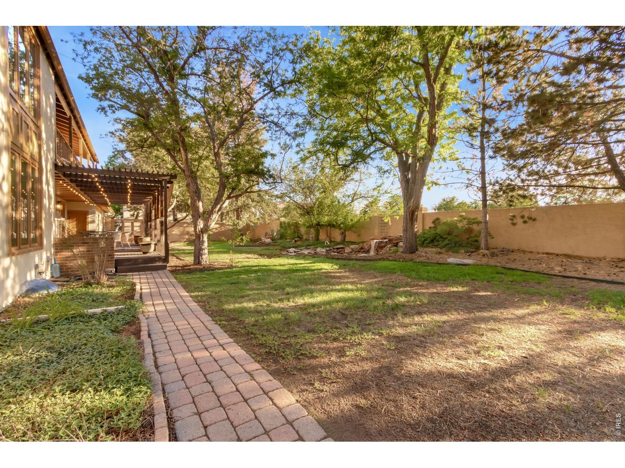Property Photo 48 Stucco privacy wall and custom Spanish-style wood gates complete the outdoor oasis.