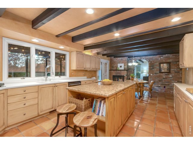 Property Photo 7 Kitchen opens directly to the backyard and outdoor living spaces.