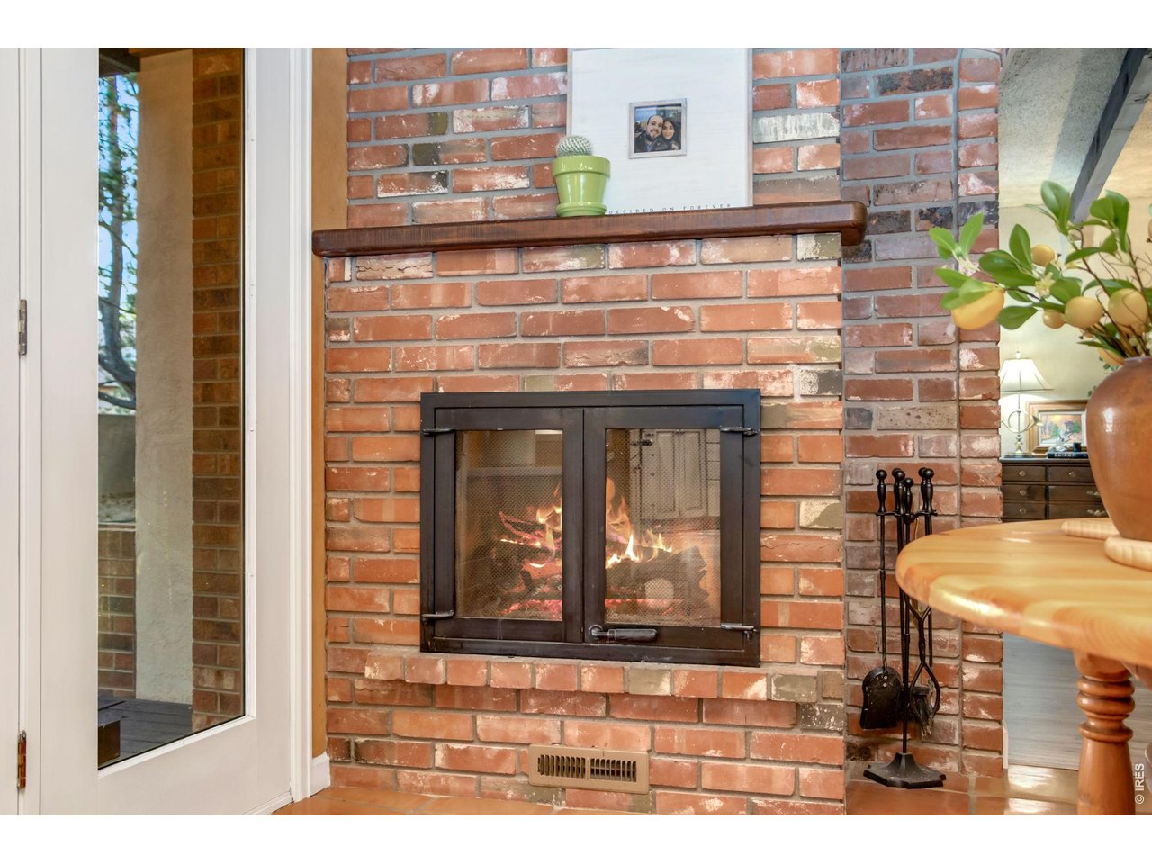 Property Photo 11 Warm and inviting eat-in kitchen with wood-burning fireplace.