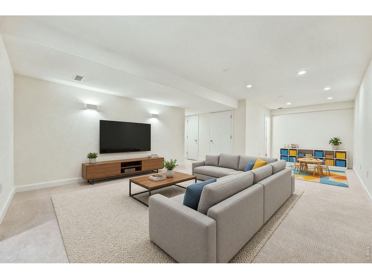 Property Photo 29 Virtually staged basement media play area