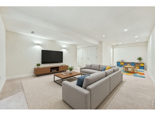 Property Photo 29 Virtually staged basement media play area