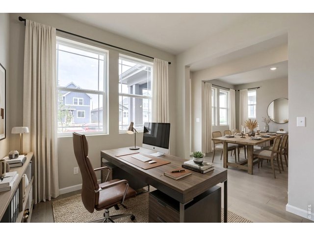 Property Photo 2 As you enter the home, you are welcomed by a home office and dining room