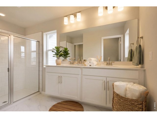 Property Photo 12 Primary bathroom with double vanities, a walk-in shower and soft-close cabnetry