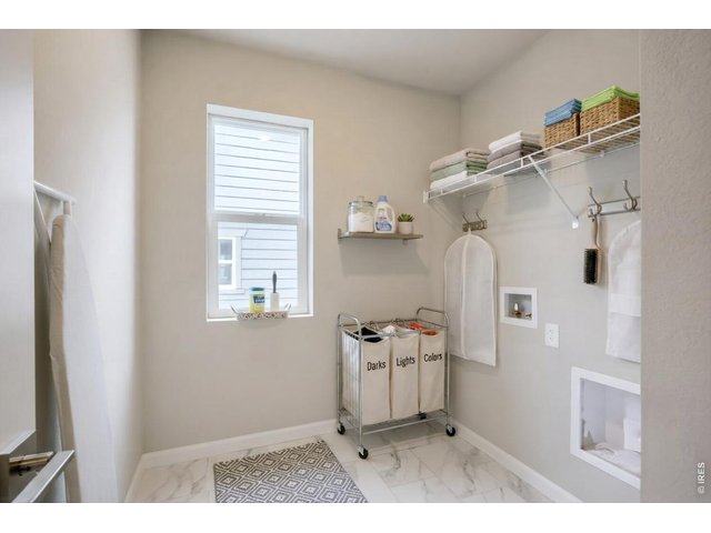 Property Photo 16 Walk-in laundry room with hook-ups