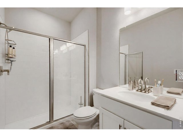 Property Photo 9 Primary walk-in shower with two undermount sinks