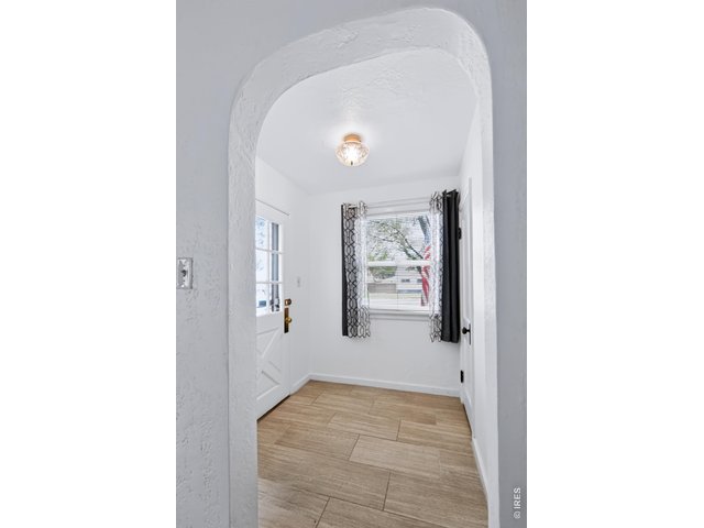 Property Photo 5 Foyer full of natural light and features a large coat closet.