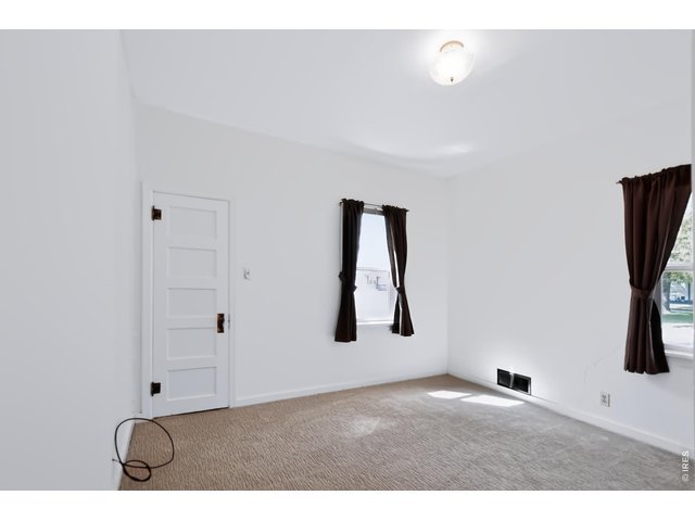 Property Photo 15 Bedroom in front of the house showing closet #1.