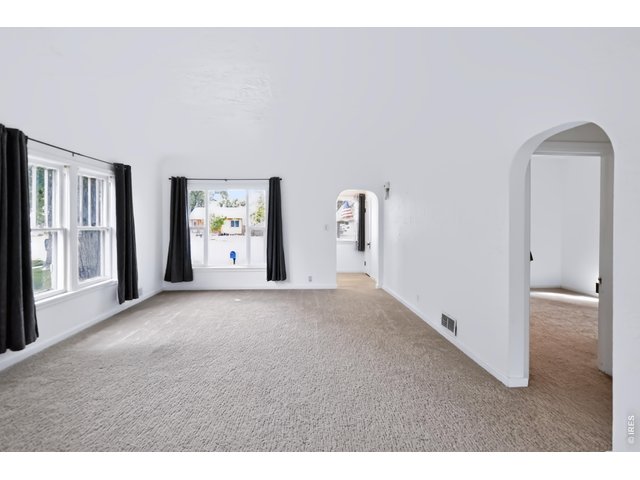 Property Photo 9 Large widows allowing natural light to fill the room.