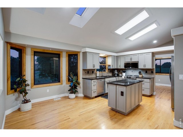 Property Photo 20 Updated kitchen with granite slab countertops