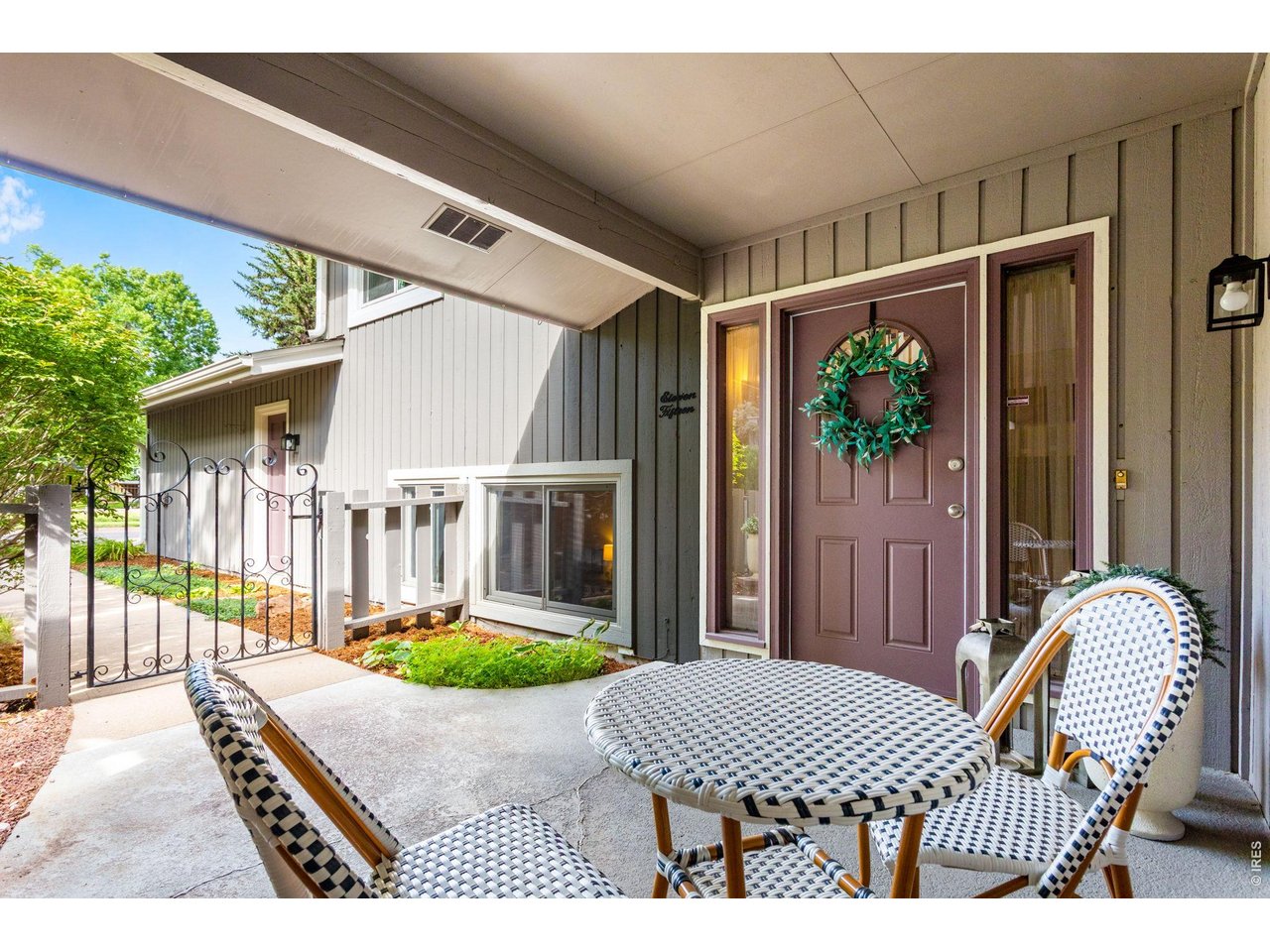 Property Photo 3 Private walk-way, gated courtyard & covered front porch with an attached finished 2 car garage.