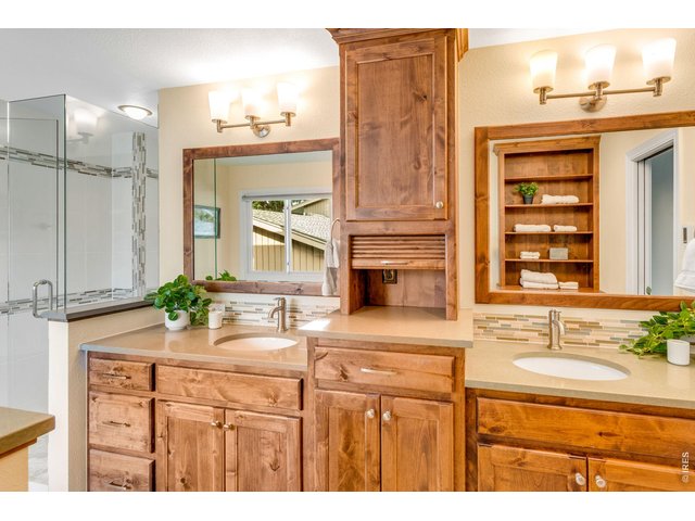 Property Photo 24 Phenomenal Spa-Inspired 5-piece Primary Bathroom by Kitchen & Bath Design Center! Poured Pan Shower tiled to the ceiling with a large frameless door and heated floors!