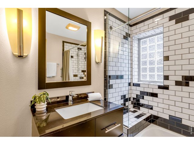 Property Photo 32 Decadent Lower Level Full Bathroom - gorgeous tile finishes - Quartz countertops throughout!