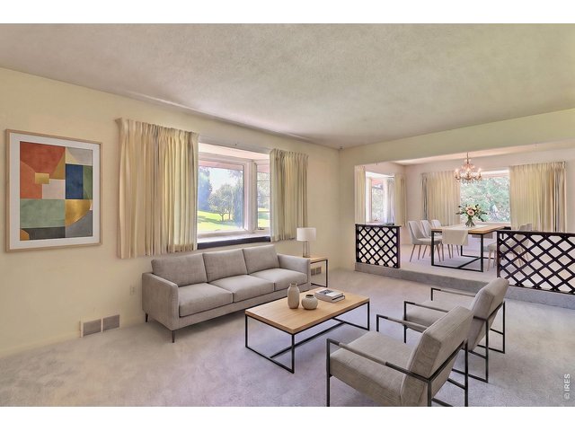 Property Photo 6 Front Door Opens to this Lovely Living Room and Formal Dining Room