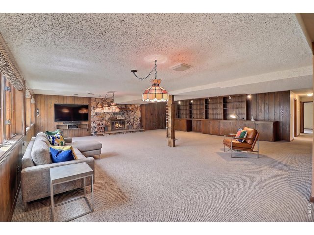 Property Photo 32 Virtually Staged Downstairs Family Room