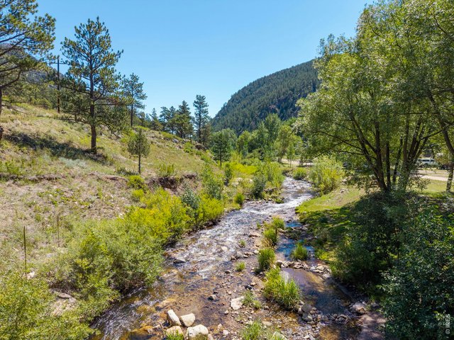 Property Photo 2 The North Fork of the Big Thompson River runs through the heart of the property.