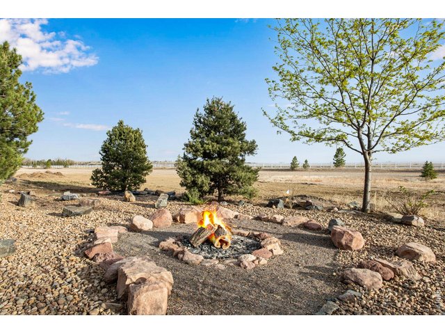 Property Photo 11 Relax or entertain with this backyard wood burning fire-pit