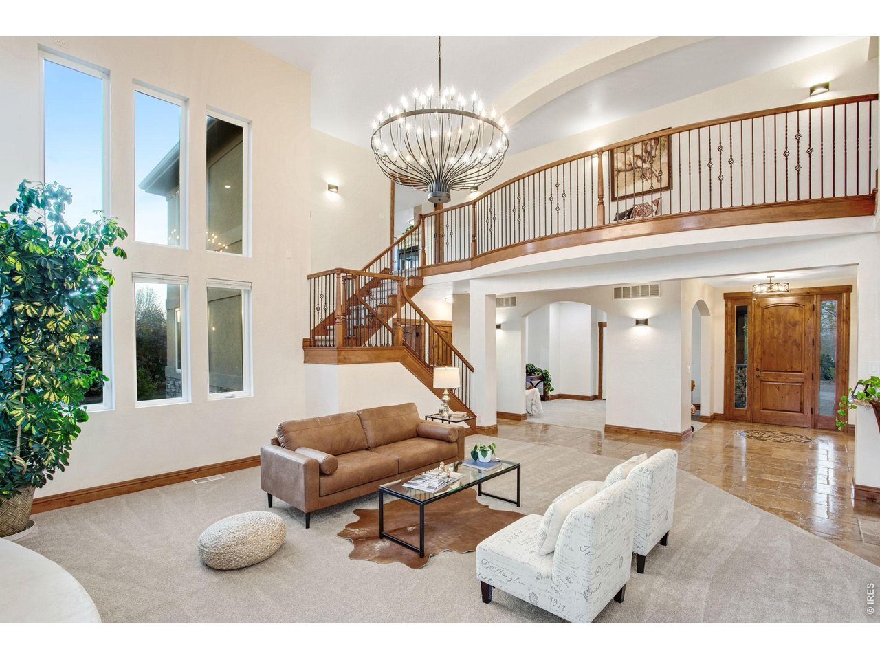 Property Photo 18 Family room features 22' vaulted ceilings new impressive 48 light chandelier, can lights, and pre-wire for surround sound