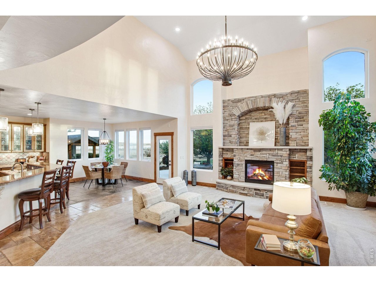 Property Photo 16 Custom stacked stone gas fireplace with poured in place concrete mantel and hearth