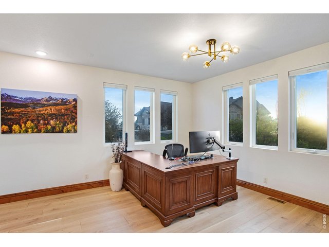 Property Photo 26 Executive office featuring French doors, patio access, European white oak engineered hardwood flooring and new light fixture