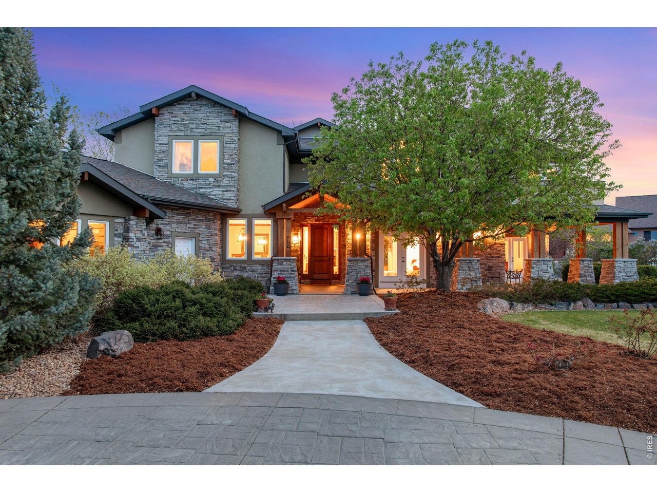 Property Photo 3 Moon shaped driveway with stamped concrete edging.