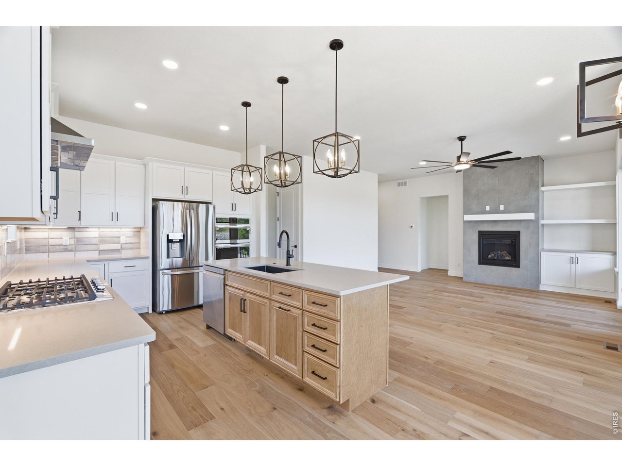 Property Photo 6 Open-concept layout designed for both entertaining and comfortable everyday living.