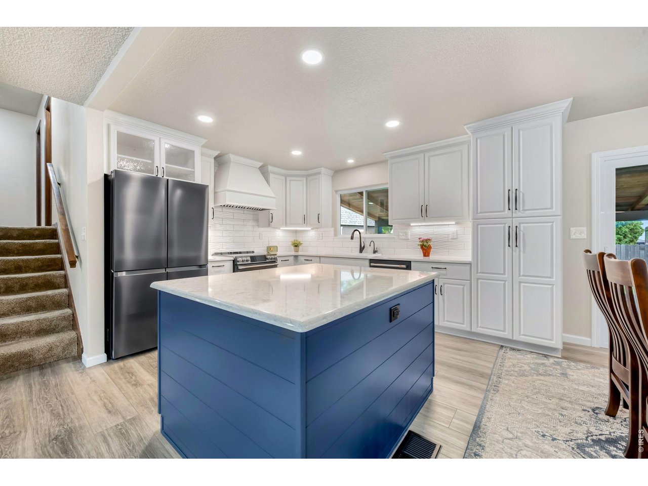 Property Photo 12 Extensively remodeled kitchen! Wall was removed to open it up, new cabinetry with pull our drawers and custom built ins.