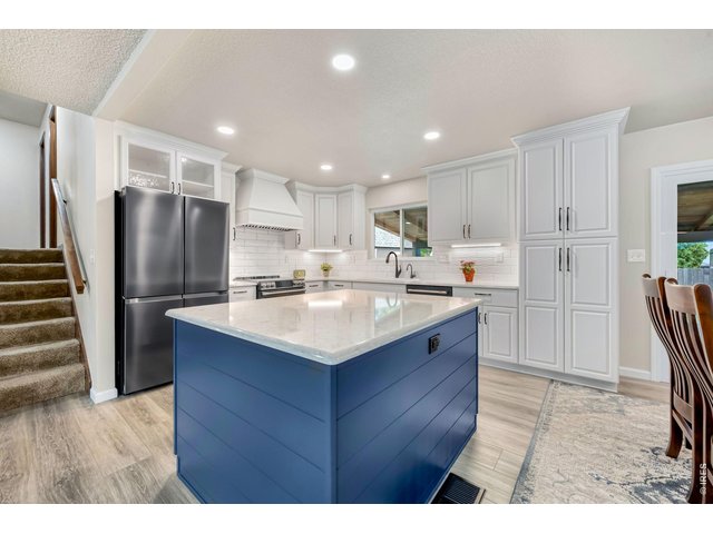 Property Photo 12 Extensively remodeled kitchen! Wall was removed to open it up, new cabinetry with pull our drawers and custom built ins.