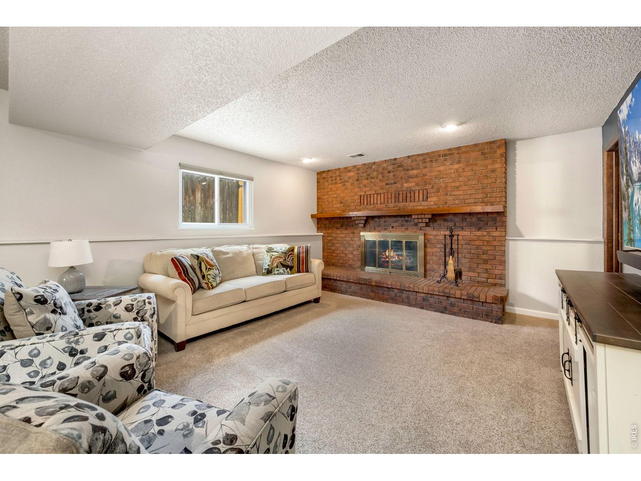 Property Photo 31 Wood burning fireplace with brick surround.