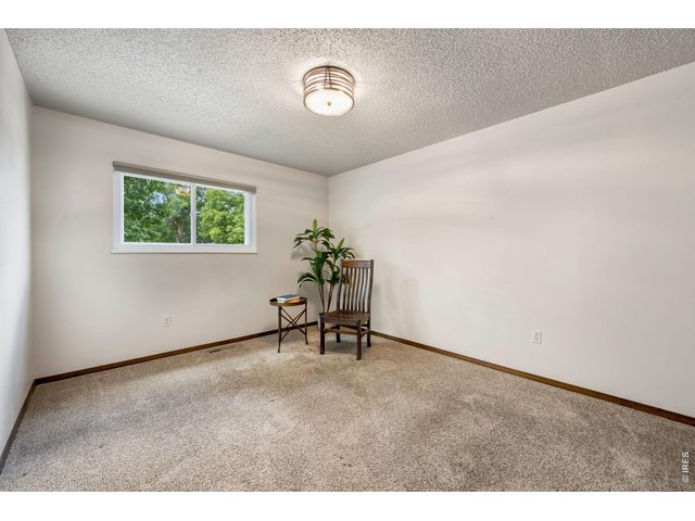 Property Photo 24 Upper level bedroom two with new window and light fixture, fresh paint.