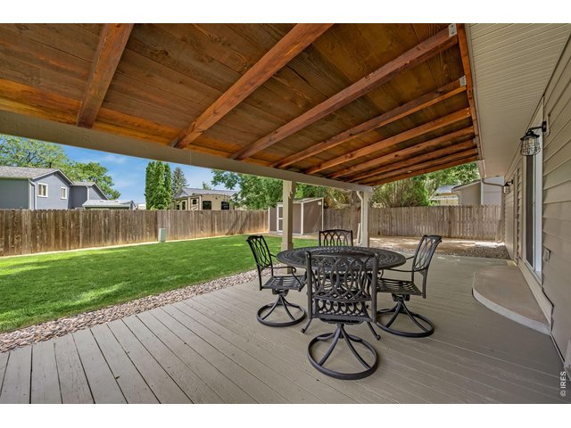 Property Photo 37 Covered back deck overlooks the backyard and is perfect for dining al fresco.
