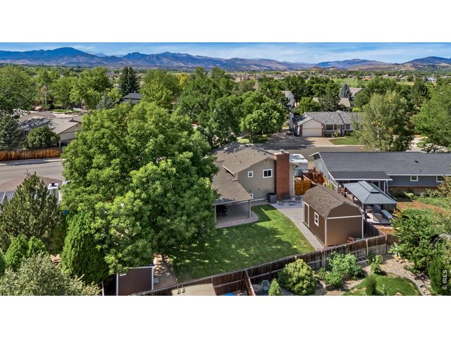 Property Photo 2 Aerial view of the backyard of 1554 Melissa and proximity to the foothills to the west.