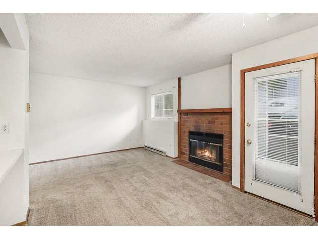 Property Photo 6 Garden level patio back door, fireplace, abundant natural light
