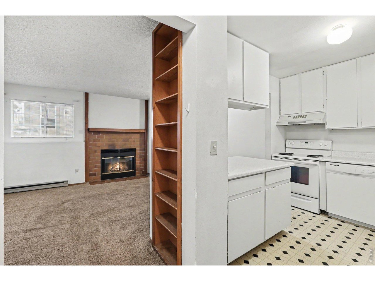 Property Photo 7 Cozy wood burning fireplace right off kitchen